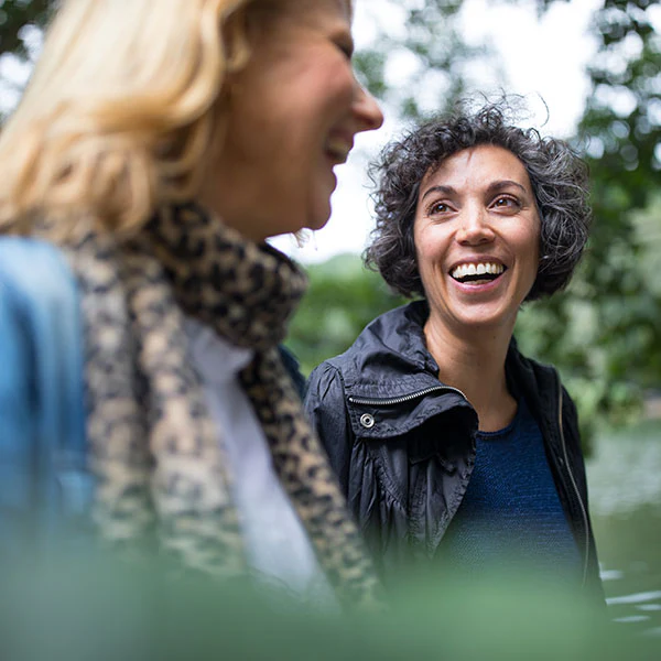 Two people smiling outdoors